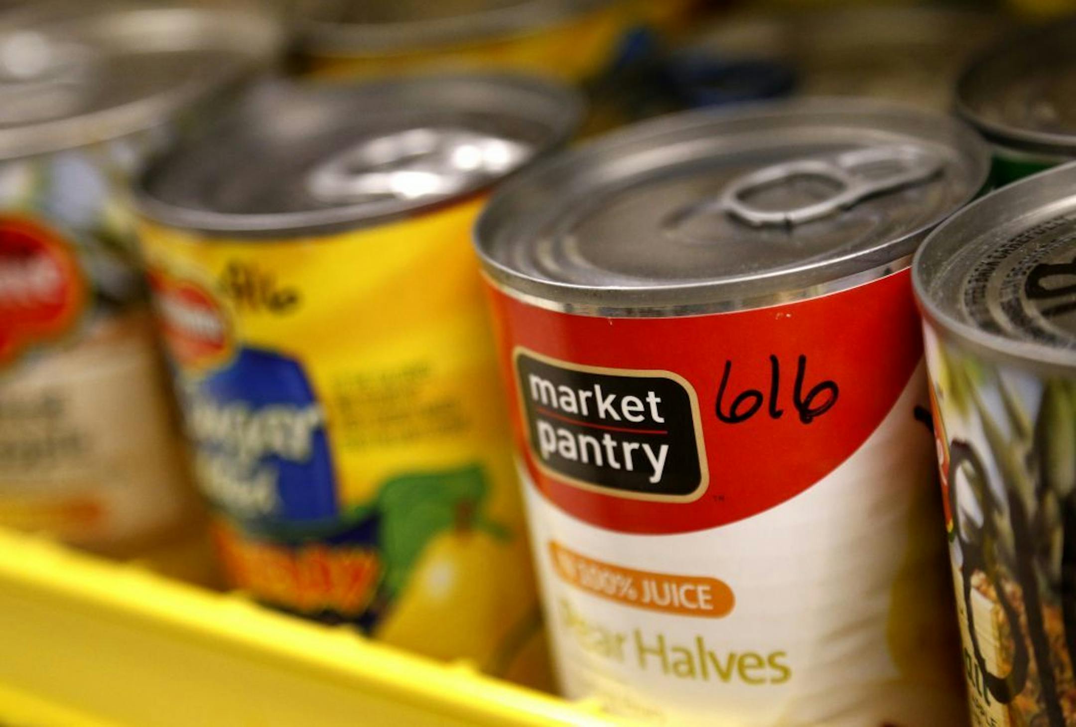 Cans were labeled and organized by expiration date. Chaska High School's "Hawk Haul" food shelf serves about 25 students weekly with its stock of canned goods, pastas and personal hygiene items.