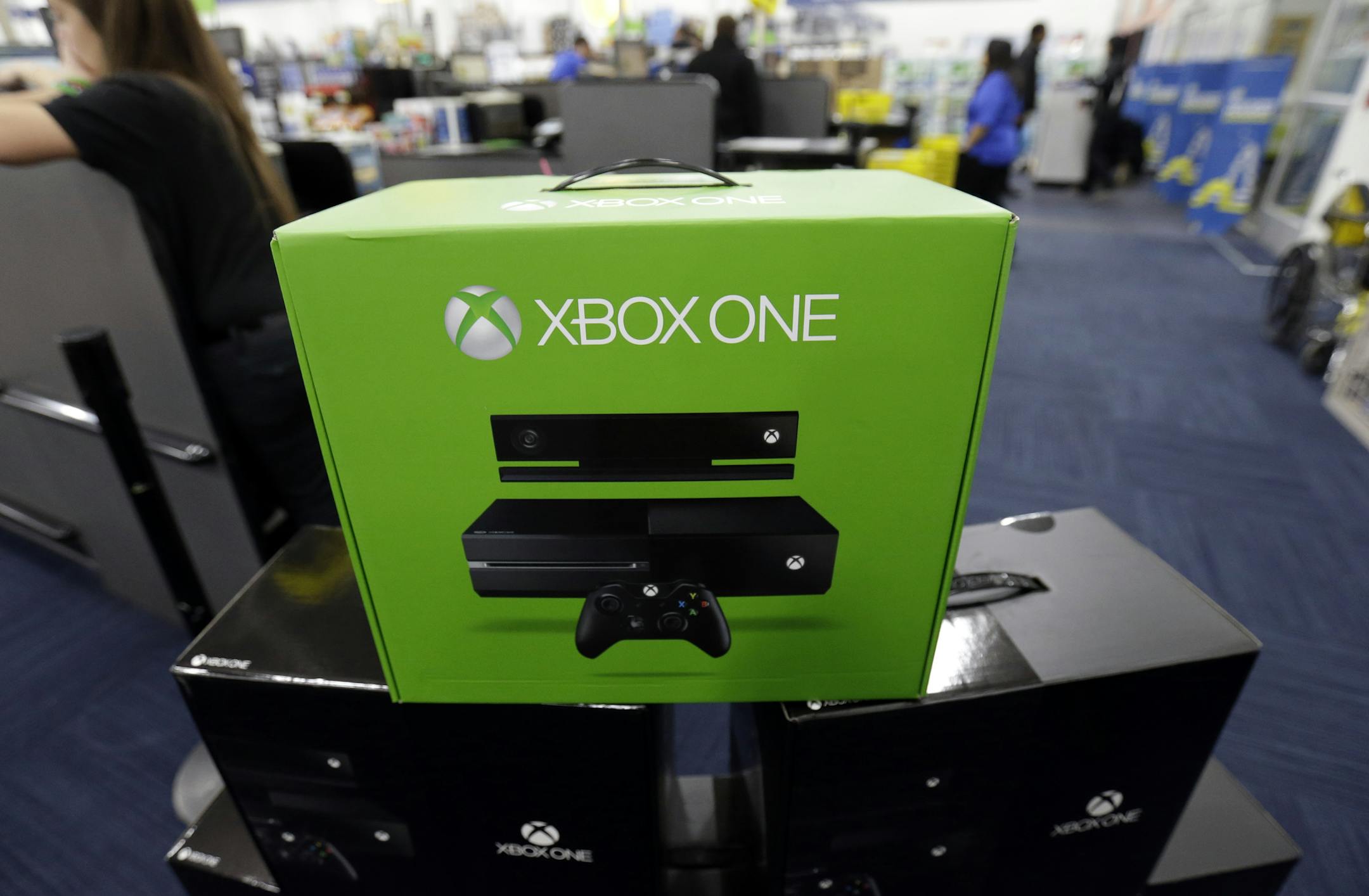 FILE - In this Friday, Nov. 22, 2013 file photo, The Xbox One is on display at a Best Buy store in Evanston, Ill. There's a couple of new foes affecting gamers who are proving to be far more destructive than any on-screen villains. With foreboding nicknames like "the blue light of death" and "the disc drive of doom," they're the glitches putting a hamper on the next-generation gaming systems Xbox One and PlayStation 4. (AP Photo/Nam Y. Huh, File)