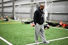 Minnesota Myth head coach Rickey Foggie laughs as players run through conditioning drills during practice on May 1. Foggie resigned two games into the