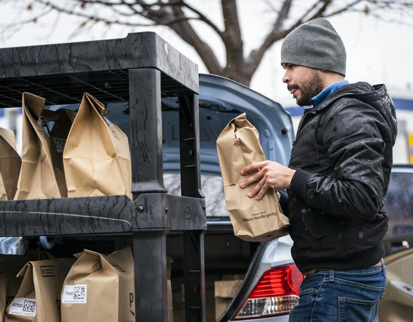 Amazon Prime Now driver Miguel Ramos of Richfield filled up his car with deliveries at the Amazon Prime Now hub. ] LEILA NAVIDI &#x2022; leila.navidi@startribune.com BACKGROUND INFORMATION: Drivers load up their cars with deliveries at the Amazon Prime Now hub in Minneapolis on Thursday, March 19, 2020.