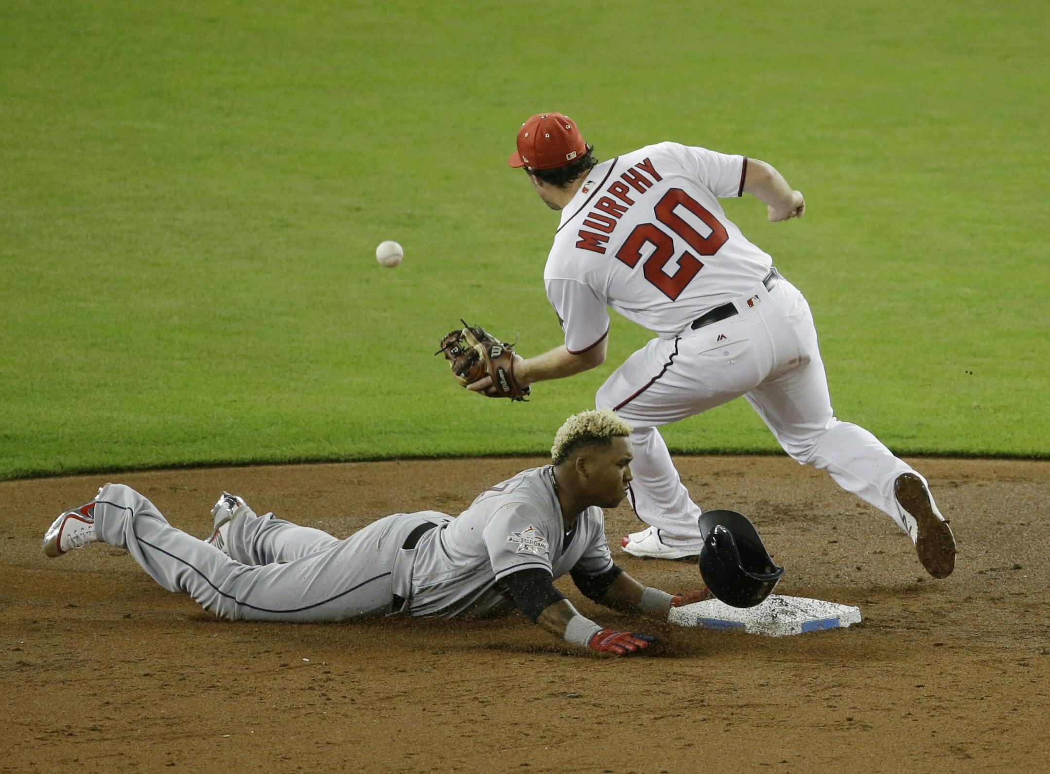 American League's Cleveland Indians Jos� Ramlrez (11), steals second base as National League's Washington Nationals second baseman Daniel Murphy (20) is late with the tag, during the third inning, during the MLB baseball All-Star Game, Tuesday, July 11, 2017, in Miami.