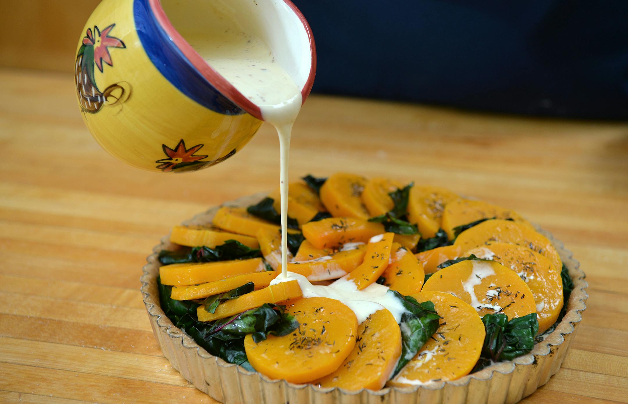 Slowly pour the egg and cream mixture over the top of the tart. ] (SPECIAL TO THE STAR TRIBUNE/BRE McGEE)