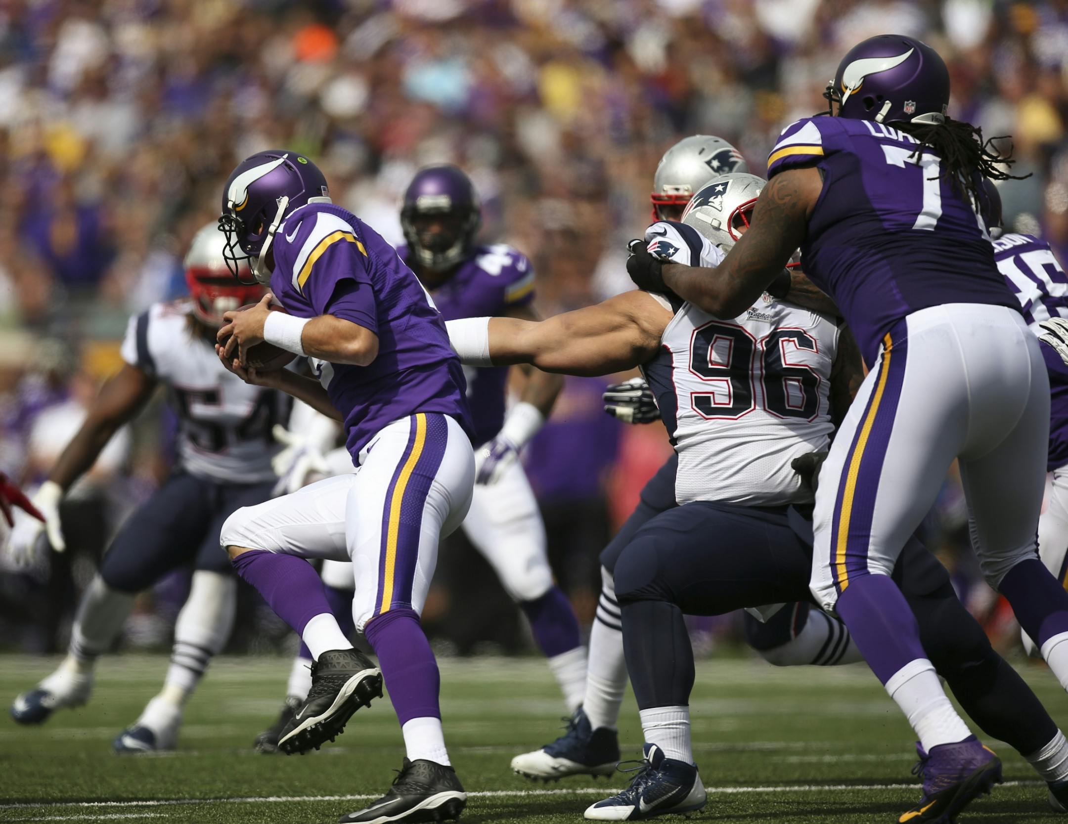 New England Patriots defensive tackle Sealver Siliga (96) slowed Minnesota Vikings quarterback Matt Cassel (16) in the first quarter Sunday at TCF Bank Stadium.