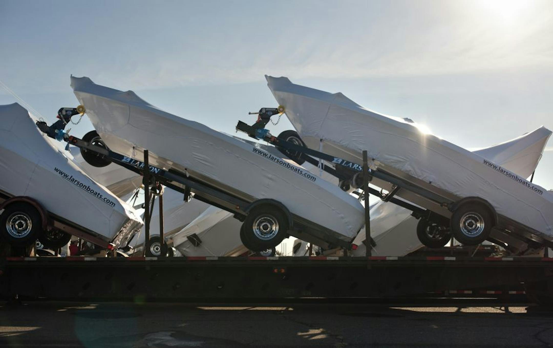 At Larson Boats' Little Falls plant, these Larsons were trailered, loaded on a truck and headed for California. In the past year the company has added 22 new models.