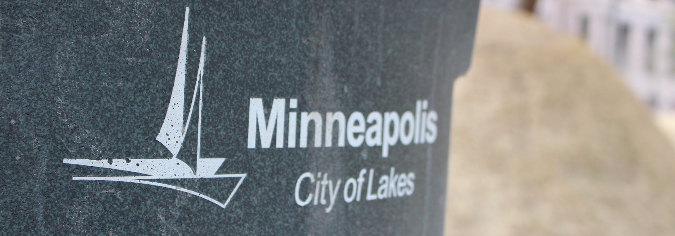 A trash can featuring the city's sailboat logo in downtown Minneapolis.