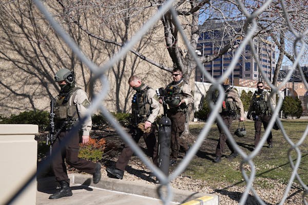 Hennepin County sheriff’s deputies in tactical gear arrived at the fortified Hennepin Medical Examiner’s Office March 25, 2021.