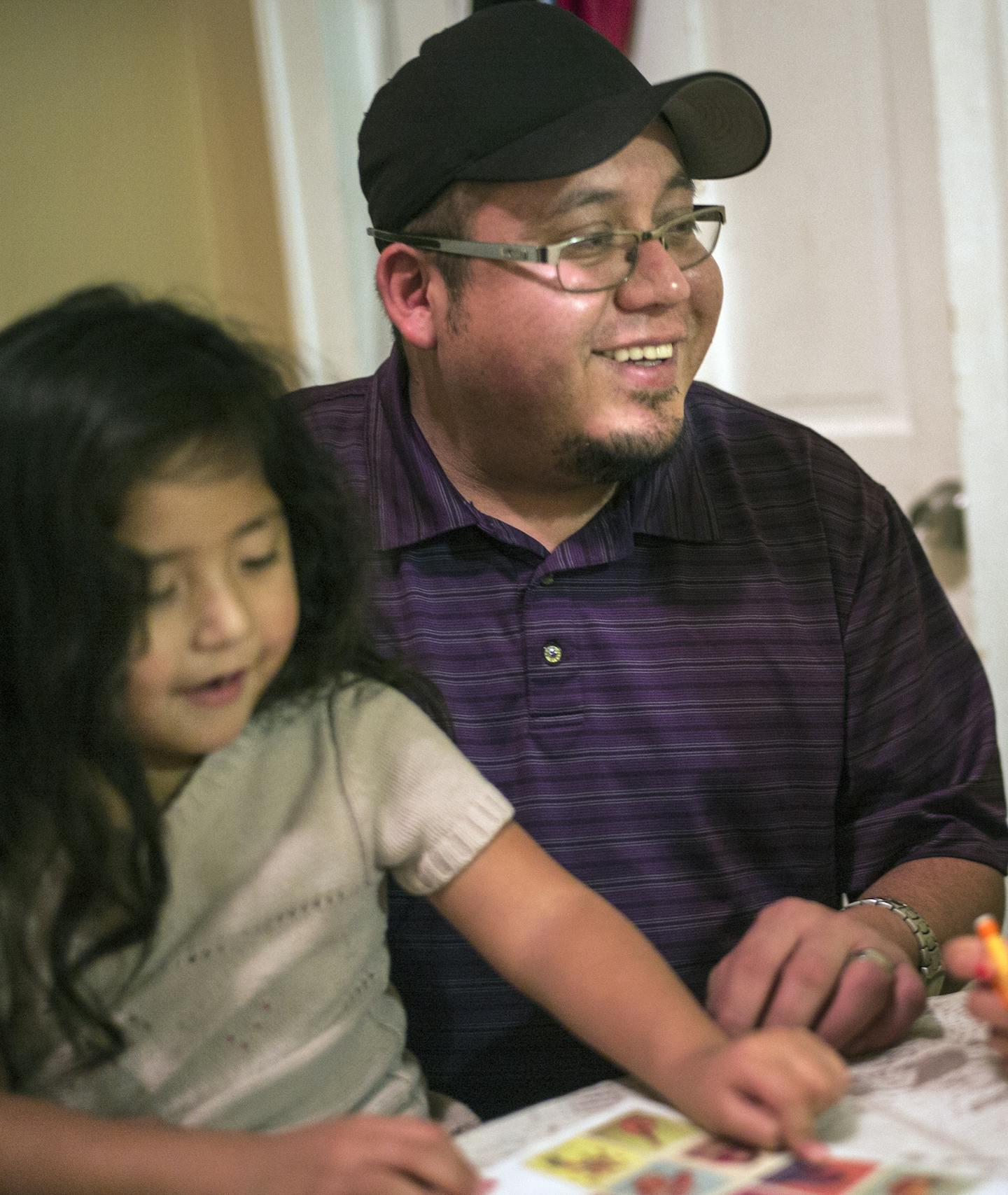 At their home in the Phillips neighborhood, Victor Soberanes, who is helping daughter Viannay,4, and niece Yeili,8, with their homework, is hoping to apply for Deferred Action for Parents of Americans, an Obama administration deportation reprieve program that is held up by a court challenge. .]Richard Tsong-Taatarii/rtsong-taatarii@startribune.com