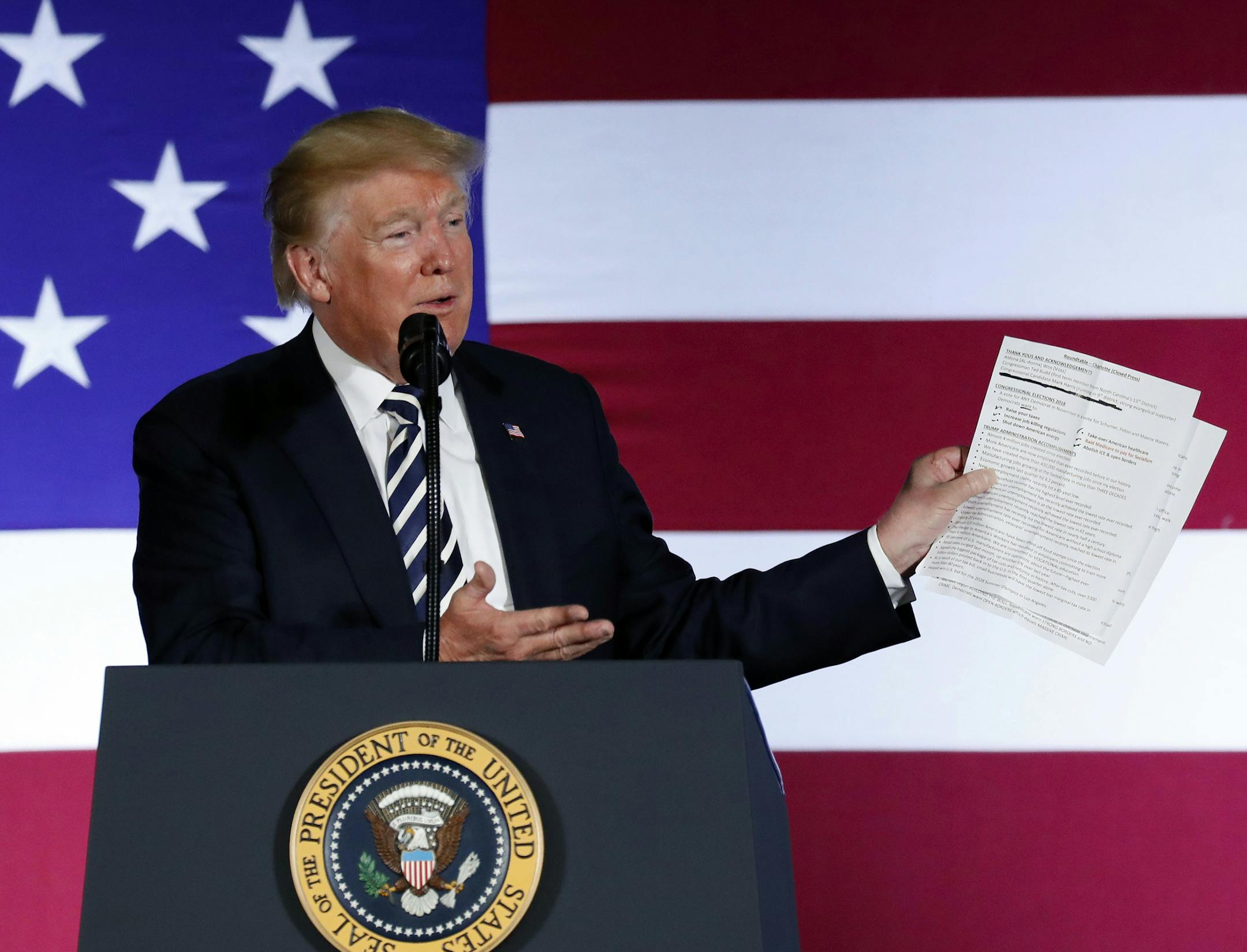 In this Aug. 31, 2018, photo, President Donald Trump holds up a list of his administrations accomplishments while speaking at a Republican fundraiser at the Carmel Country Club in in Charlotte, N.C. President Donald Trump is starting his Labor Day with an attack on a top union leader. Trump tweeted Monday that AFL-CIO President Richard Trumka ìrepresented his union poorly on television this weekend.î He added: ìit is easy to see why unions are doing so poorly. A Dem!î Trumka