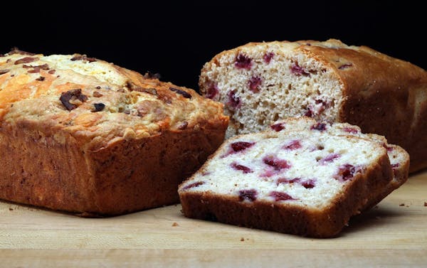 Go sweet or savory with summery quickbreads: Bacon-Cheddar Quick Bread, left, and Cherry Almond Sweet Bread.