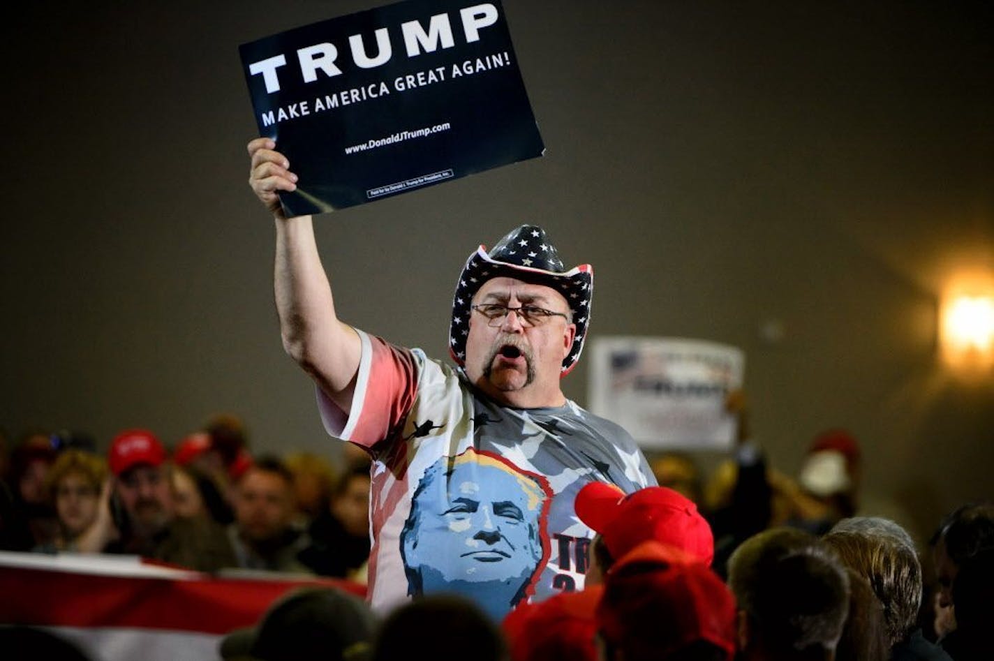 Randal Thom of Lakefield, MN cheered on the crowd before the rally. Republican presidential candidate Donald Trump spoke at a town hall setting in Janesville, Wis.