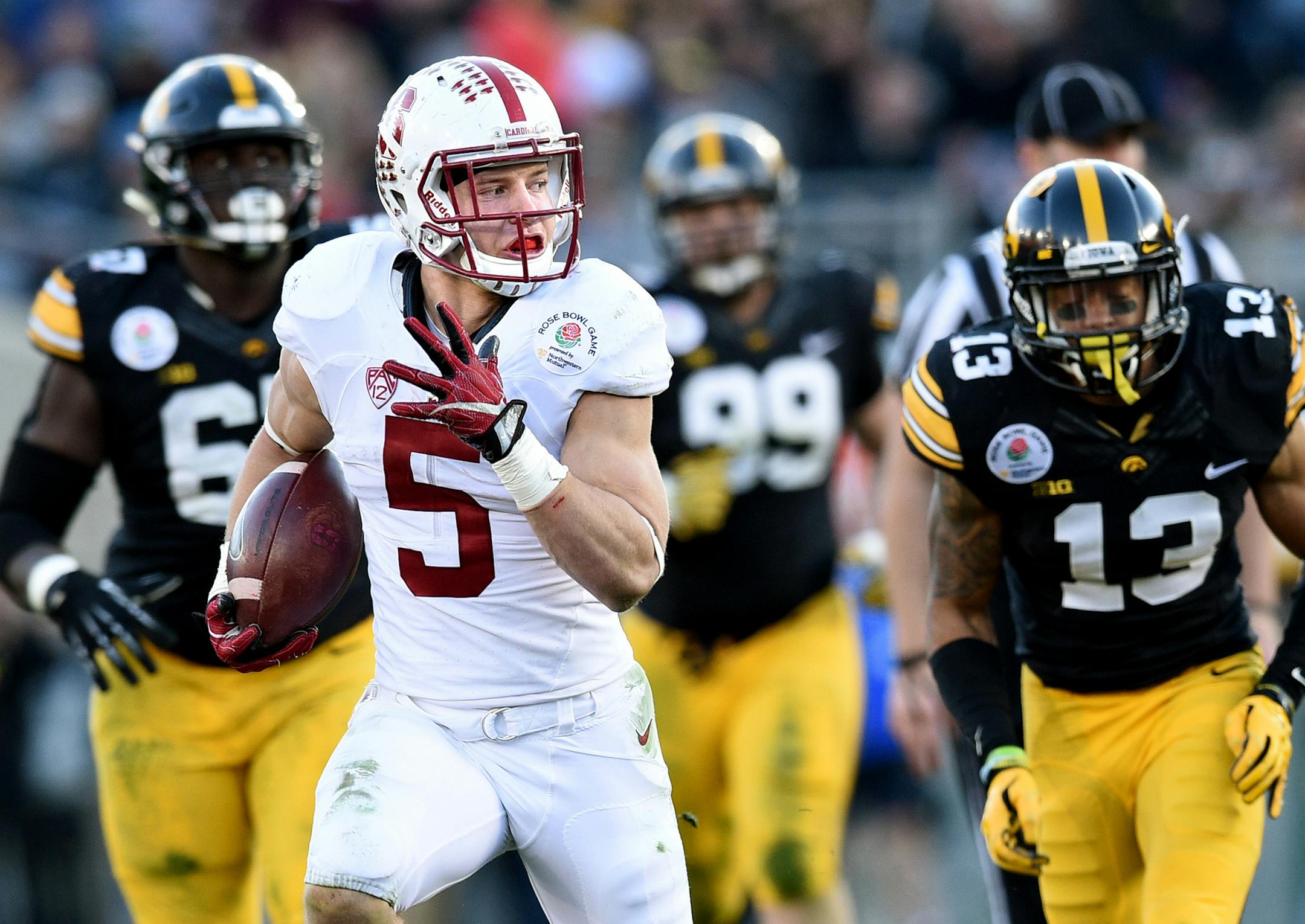 Stanford running back Christian McCaffery (5) beats the Iowa defense for a 30-yard run in the third quarter during the 102nd Rose Bowl on Friday, Jan. 1, 2016, at the Rose Bowl in Pasadena, Calif. Stanford won, 45-16. (Wally Skalij/Los Angeles Times/TNS)