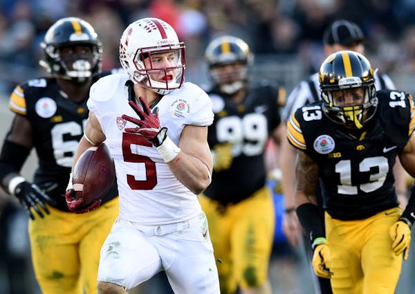 Stanford running back Christian McCaffery (5) beats the Iowa defense for a 30-yard run in the third quarter during the 102nd Rose Bowl on Friday, Jan.