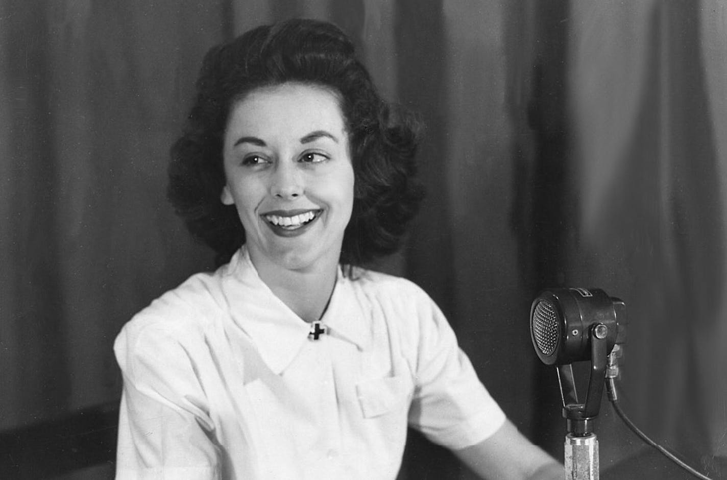 Virginia Allen sitting with a radio mike on the "GI Jill" program, Agra, India. credit: The Library of Congress American Folklife Center