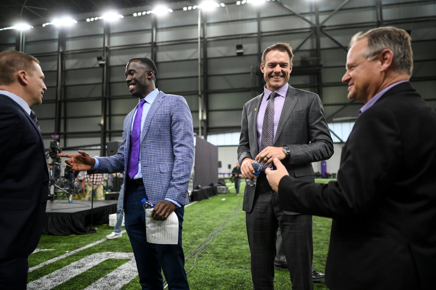 From left, Jeff Anderson, VP of Strategic and Corporate Communications, speaks to General Manager Kwesi Adofo-Mensah as new head coach Kevin O'Connell speaks to Bob Hagan, Vikings VP of Football and Media Communications