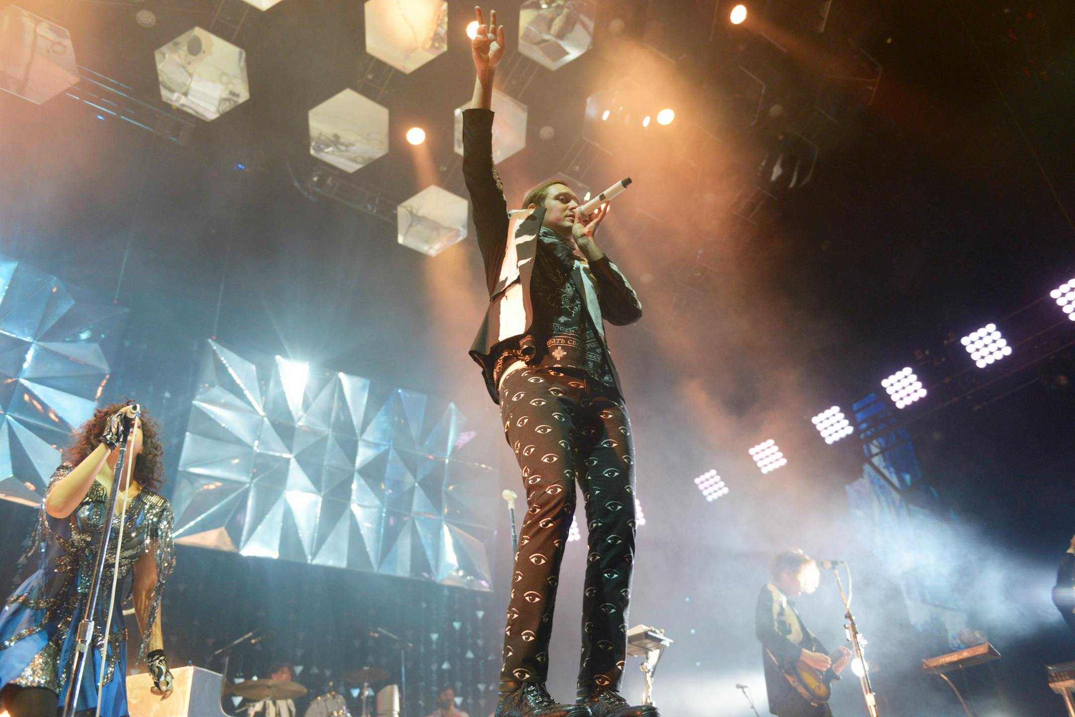 Arcade Fire's Win Butler, center, performed in front of a 12-piece band and an equally mega-minded visual backdrop at Target Center.