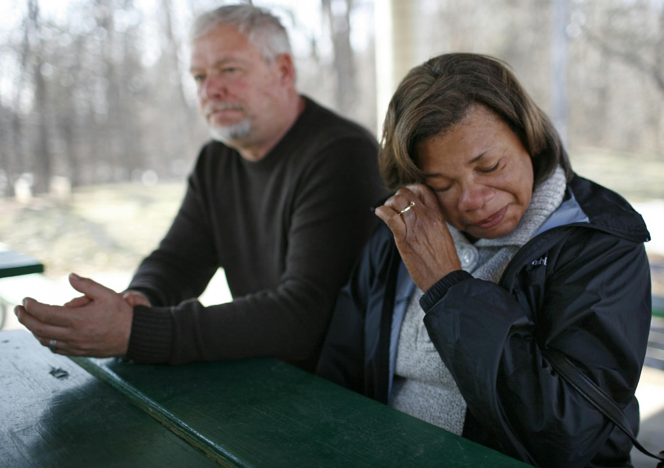 Shirley Bak, right, wipes a tear as she speaks with a STAR TRIBUNE reporter about her son Travis Benjamin, the 39-year-old who went missing after his Hummer went into the Mississippi River early Friday morning in Ramsey. At right is Clemons Bak, Benjamin's stepfather.