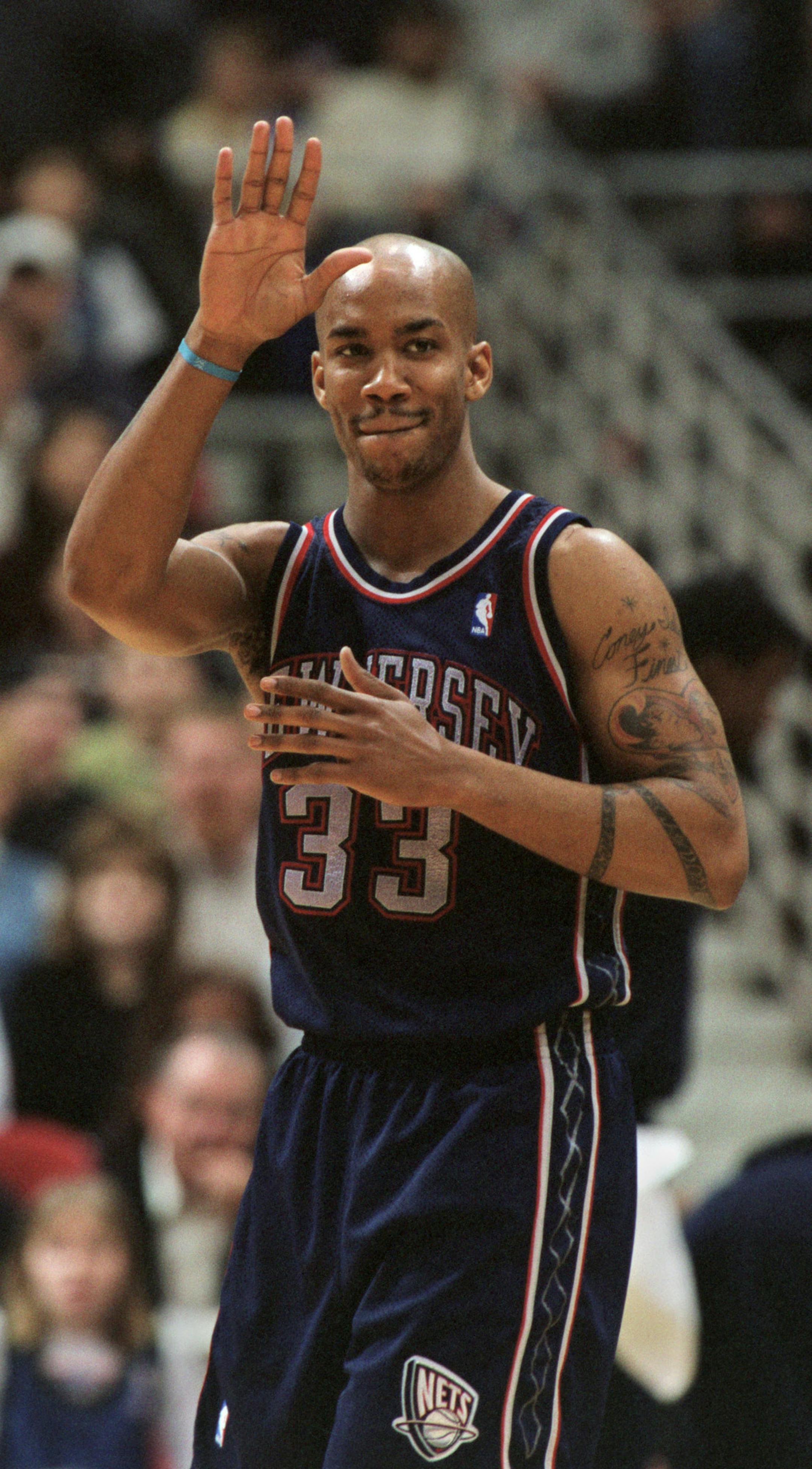 MINNEAPOLIS - 2/20/00 - Stephon Marbury came back to Minnesota for the first time since being traded to the New Jersey Nets and led his team with 39 points while beating the Timberwolves 91 - 89 Sunday afternoon at Target Center. -- Just before the tip off Sunday afternoon, former Timberwolve, Stephon Marbury, waved to (I think) Kirby Puckett, seated courtside near the Wolves bench. ORG XMIT: MIN2017021317301351