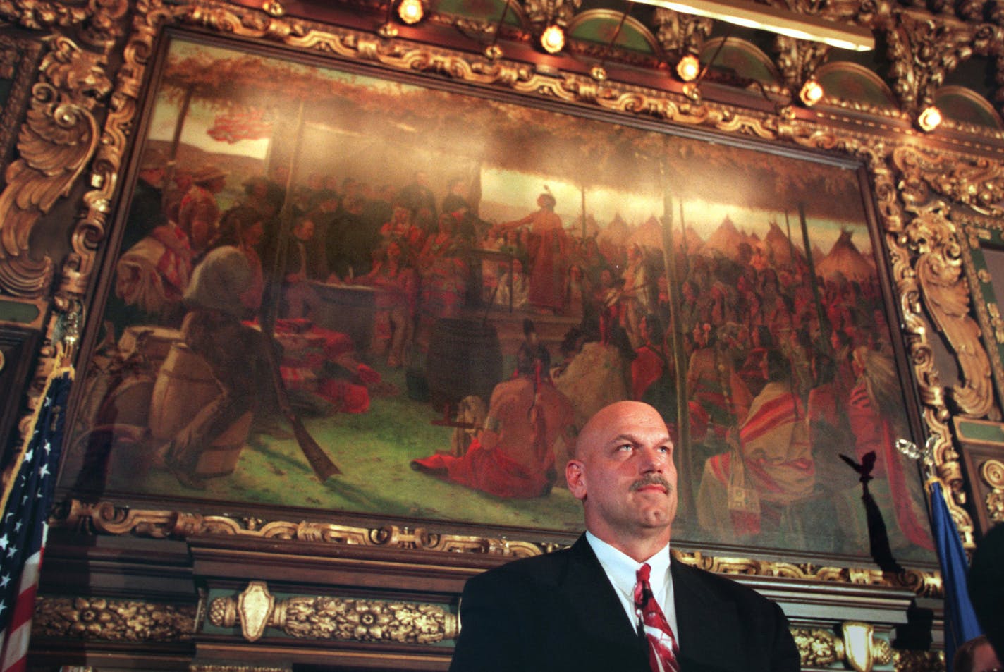 The morning after. -- Jesse Ventura at the Capitol during introduction by Gov. Carlson on Wednesday morning. He's standing in the Governor's Reception Room in front of a historic painting portraying the beginnings of the State of Minnesota. ORG XMIT: MIN2014071217572978 ORG XMIT: MIN1507011839010272