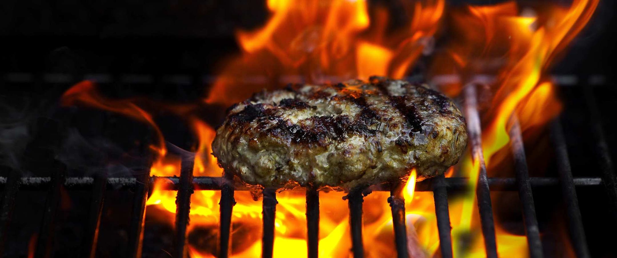 A Pork Burger cooking on the grill in Port Ewen, N.Y., May 16, 2010. Traditionally made out of beef, hamburgers have evolved to include ingredients such as shrimp and lamb. (Francesco Tonelli/The New York Times)