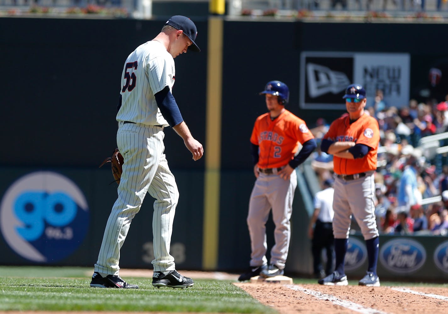 Minnesota Twins pitcher Tyler Duffey heads to the dugout as he is pulled in the seventh inning of a baseball game against the Houston Astros, Wednesday, May 31, 2017 in Minneapolis. The Astros won 17-6, sweeping the three-game series. (AP Photo/Jim Mone)