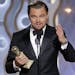 Leonardo DiCaprio accepts the award for best actor in a motion picture comedy for his role in "The Wolf of Wall Street" during the 71st annual Golden 