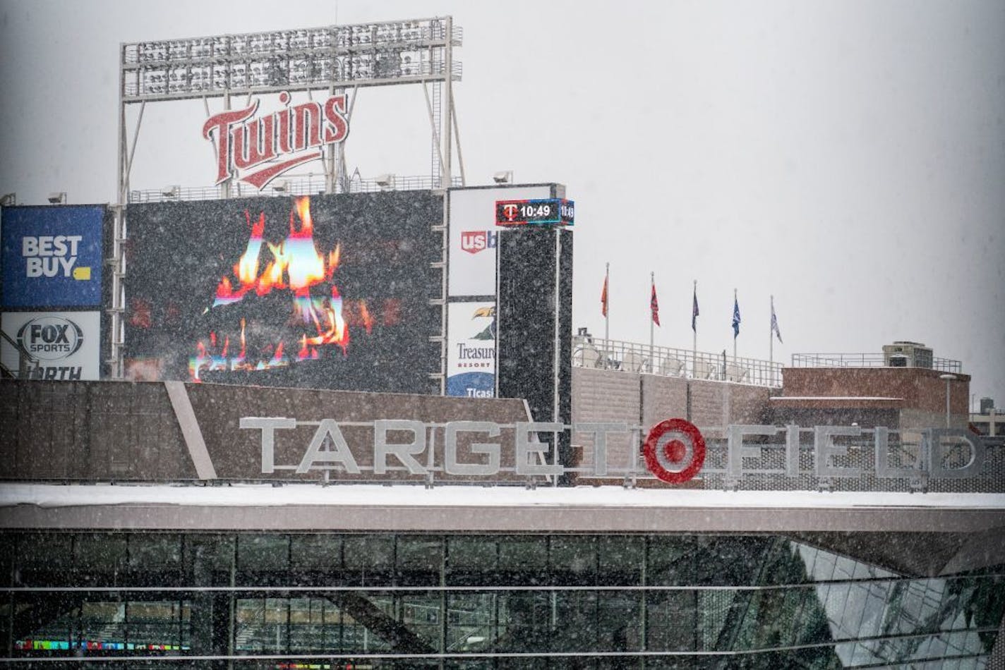 The fireplace video won't help dry the field or keep anyone warm, but it was a nice scoreboard display.