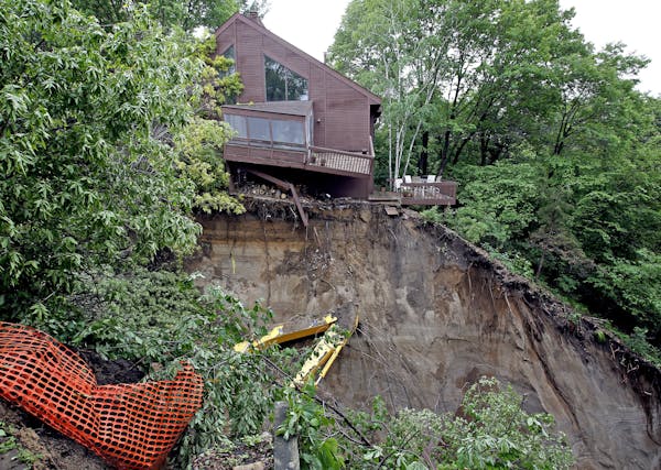 Damage from a mudslide that occurred on Sunday morning on Burr Ridge Lane, Eden Prairie, Minn. Heavy rains overnight causes some flooding and this mud
