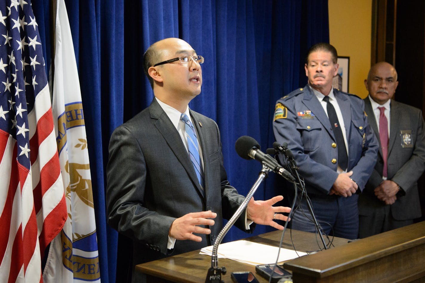 Ramsey County Attorney John Choi, speaking at a news conference this morning, filed criminal and civil charges against the archdiocese last summer for its failed oversight of a former priest. On the right St. Paul Police Chief Tom Smith and Asst Chief Bill Martinez.