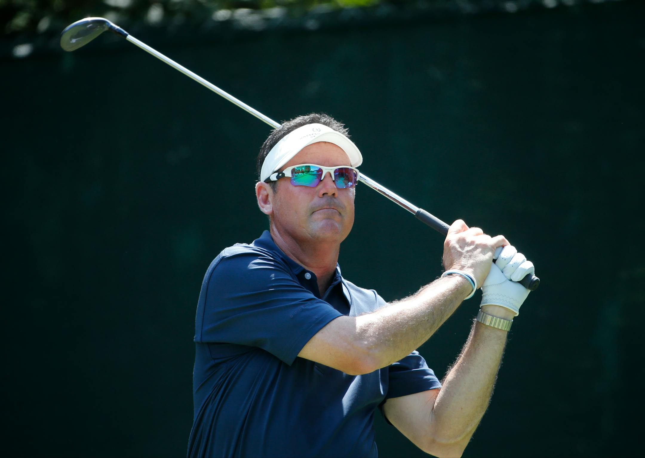 Rich Beem watches his tee shot on the 16th hole during the first round of the PGA Championship golf tournament at Baltusrol Golf Club in Springfield, N.J., Thursday, July 28, 2016. (AP Photo/Mike Groll)