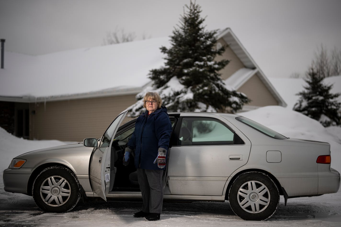 Peggy Hiestand-Harri stands for a portrait alongside her 2001 Toyota Camry Friday, Jan. 20, 2023 in Hermantown, Minn.. Hiestand-Harri is an AARP advocate and retired nutritionist who wants lawmakers to get rid of the tax on social security income. She lives alone after her husband's ALS diagnosis and death and has to pinch her pennies to afford high energy bills, insurance and her aging home and 2001 Toyota Camry. Minnesota Democrats are divided on a proposal to eliminate the state's tax on Social Security benefits, a popular idea with a hefty price tag for the state's budget. The Department of Revenue estimates eliminating the tax would impact 473,000 Minnesota filers in 2023, who would see an average of $1,276 in tax relief. Minnesota is one of only 11 states in the nation that impose a tax on the benefits, a distinction that some argue contributes to retirees living elsewhere for part of the year. No bordering states have a state tax on Social Security. ] AARON LAVINSKY • aaron.lavinsky@startribune.com