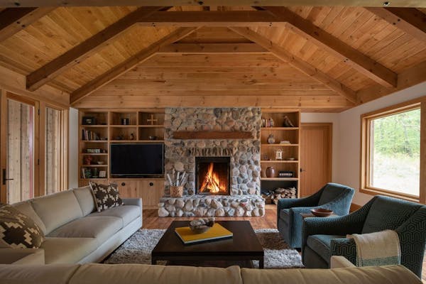 The Rogers family handpicked the fieldstone from their land for the living room fireplace surround. The new-fashioned farmhouse in Avon, Minn., was de