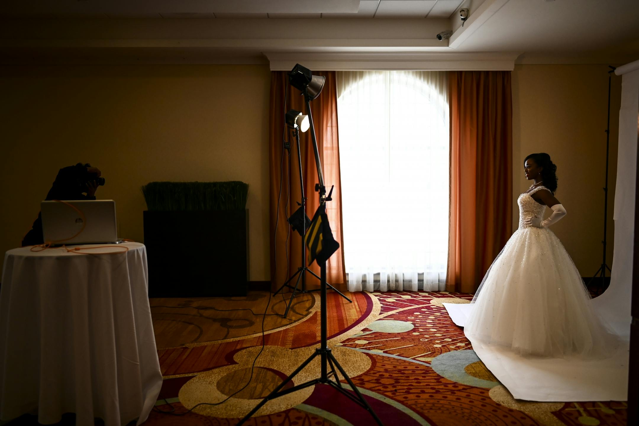 Lauren Tiffany Cooper, a senior honor student at Minnetonka High School, posed as she was photographed by Nagashia Jackson, of Minneapolis, Saturday afternoon a few hours before the start of the debutante ball.