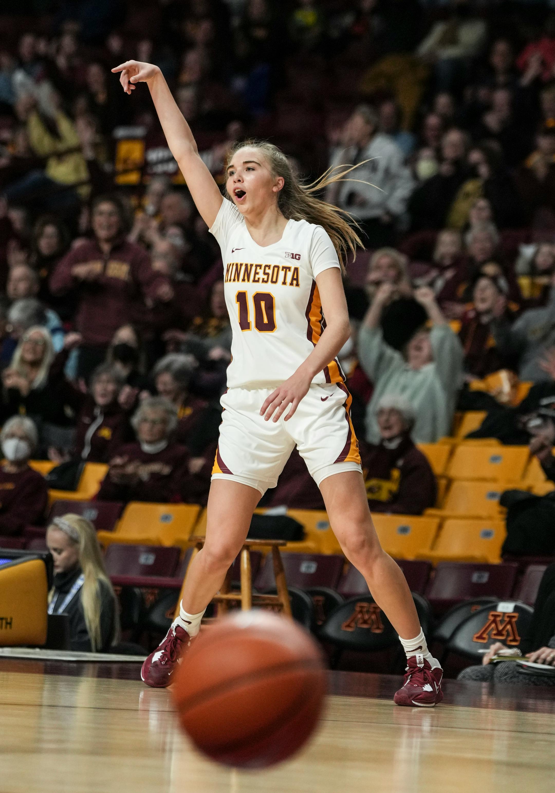 Minnesota Gophers guard Mara Braun (10) reacts after scoring a three point basketball to tie the game at the end of the first half.