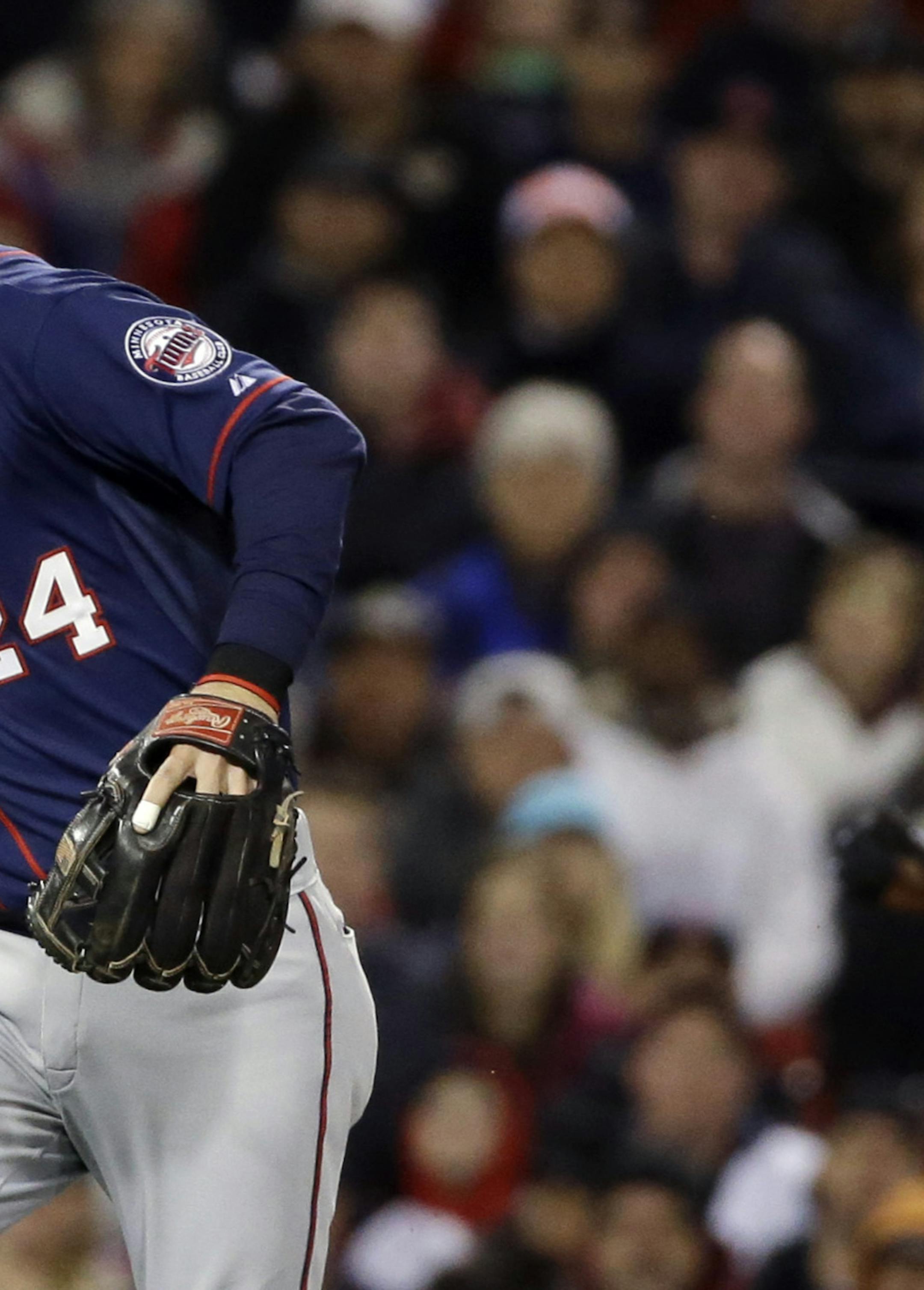 Minnesota Twins third baseman Trevor Plouffe (24) throws to first base to get Boston Red Sox's Rusney Castillo for the third out of the fifth inning in a baseball game at Fenway Park in Boston, Tuesday, June 2, 2015. Running at right is Xander Bogaerts. (AP Photo/Elise Amendola)