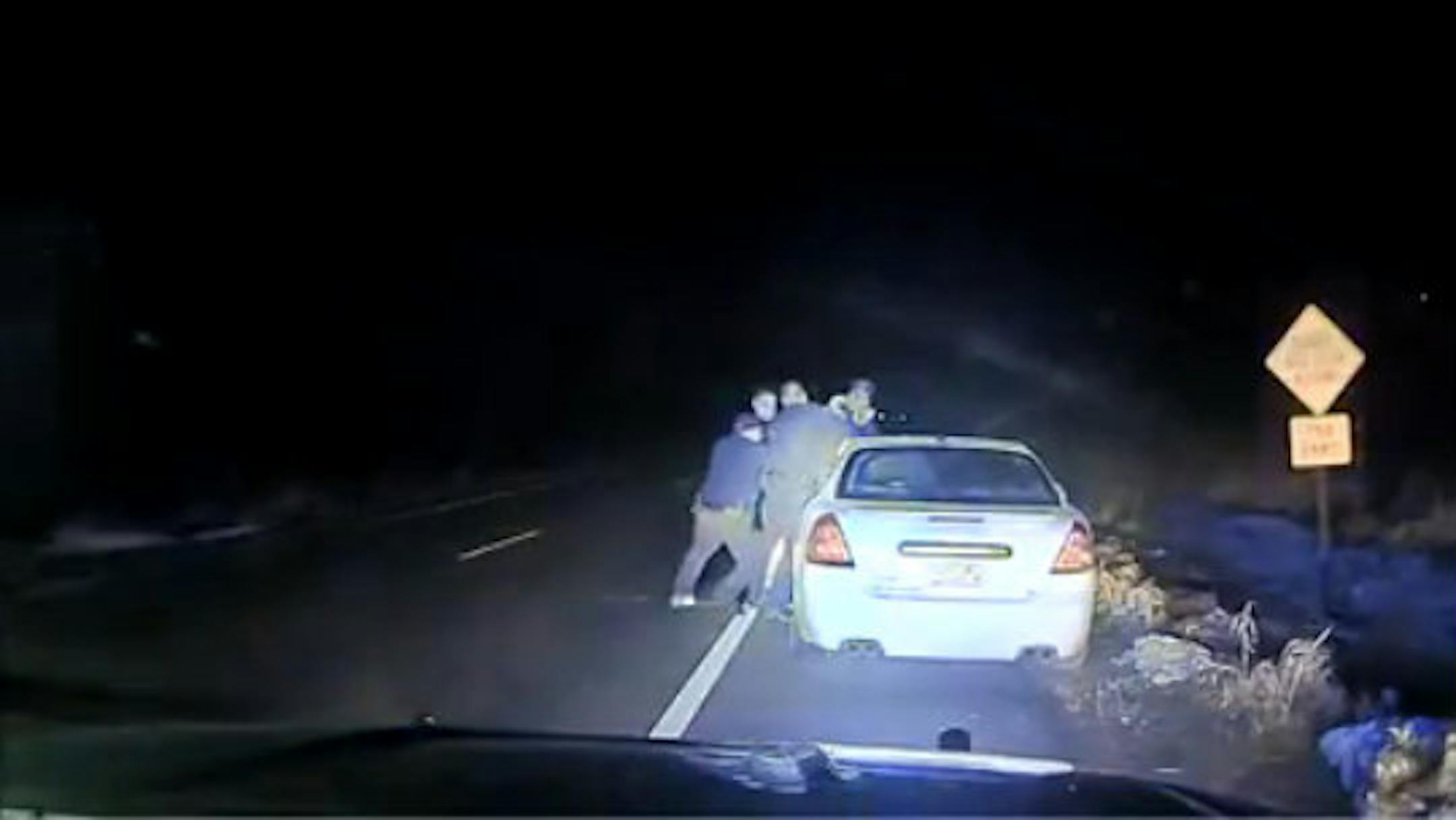 Dashcam video shows the incident where a passenger of the car grabbed for a police officer's gun, near Cloquet.