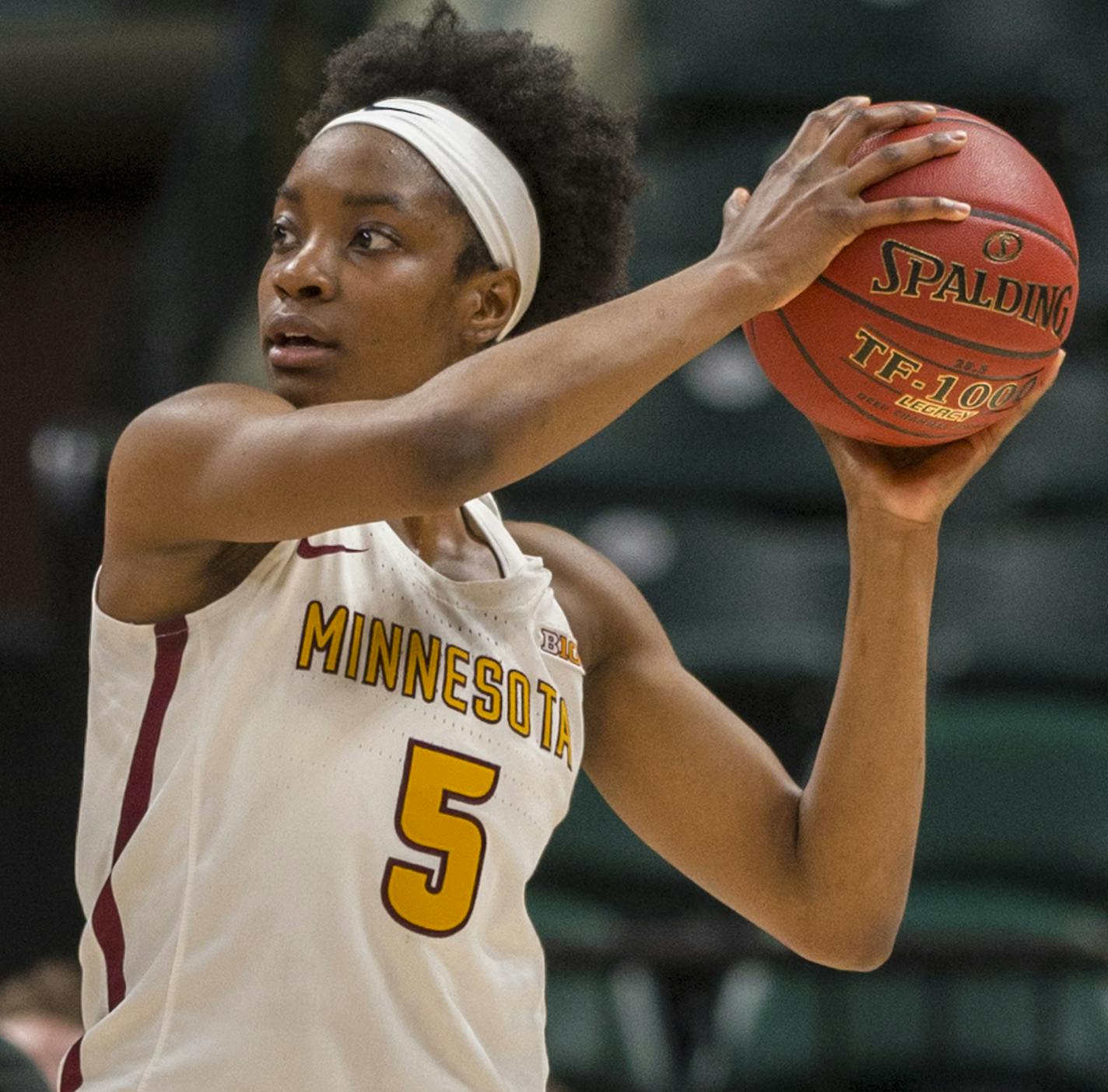 Minnesota Golden Gophers forward Taiye Bello (5) looks for a teammate to pass to during the first half of a quarter-final game in the 2018 NCAA Big Ten Womens' Basketball tournament at Bankers Life Fieldhouse in Indianapolis, Friday, March 2, 2018.