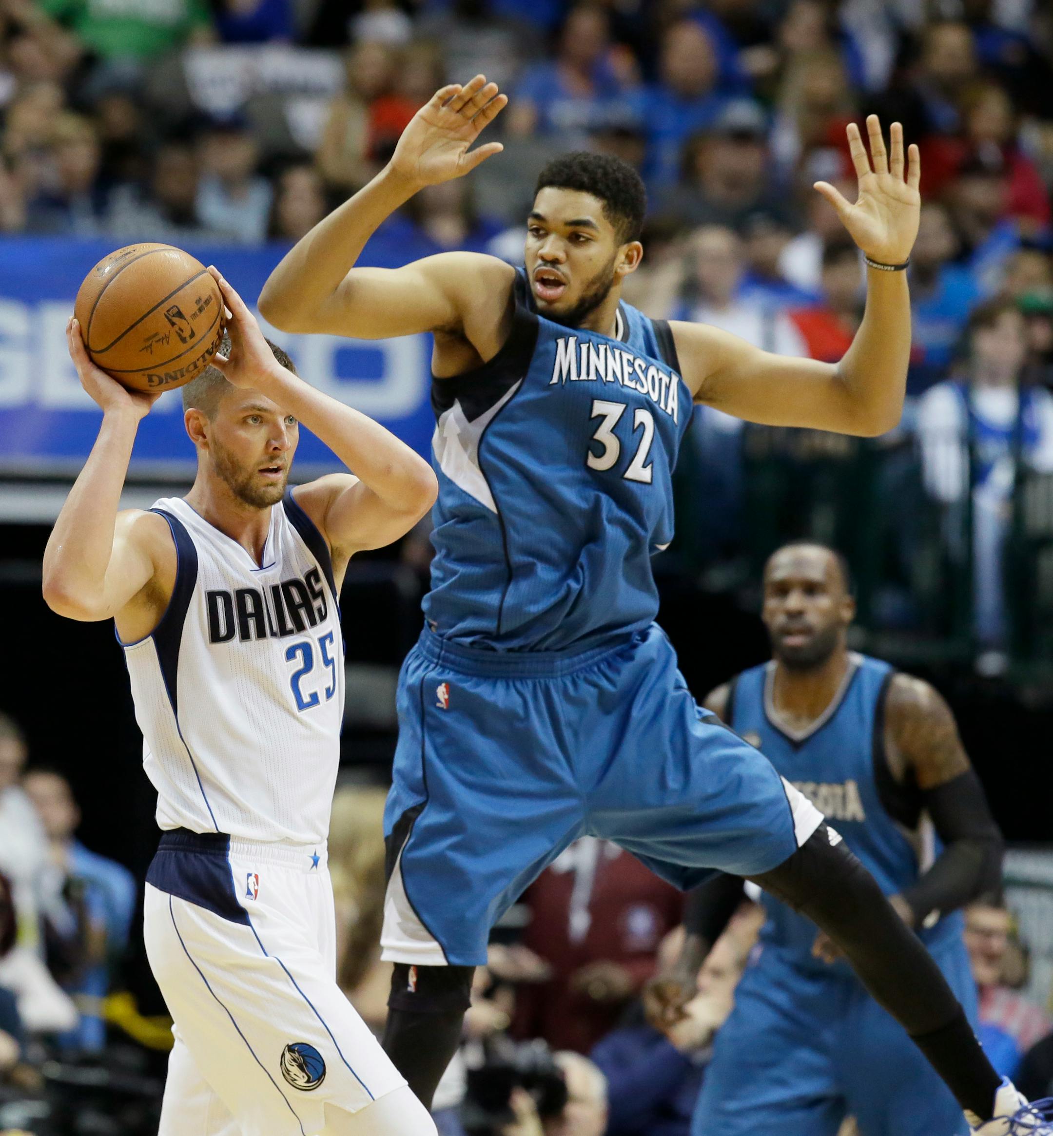Dallas Mavericks forward Chandler Parsons (25) looks to pass against Minnesota Timberwolves center Karl-Anthony Towns (32) during the first half of an NBA basketball game Sunday, Feb. 28, 2016, in Dallas. (AP Photo/LM Otero)