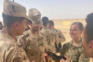 Taylor Ritchot providing medical assitance to wounded soliders in Kuwait during the United States military's withdrawal from Afghanistan in 2021.