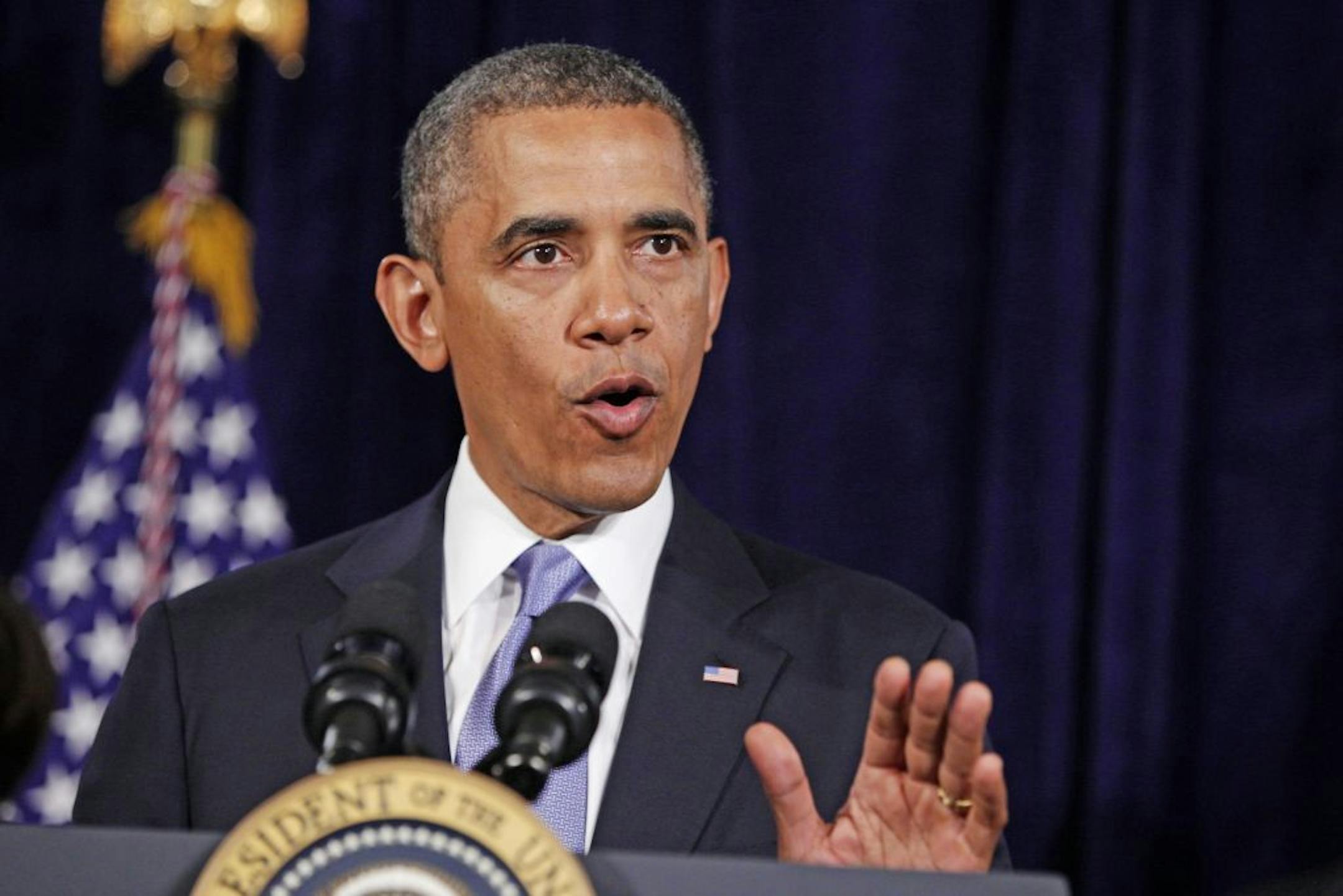 President Barack Obama gestures during a statment about the Affordable Care Act, Friday, June 7, 2013, in San Jose, Calif. Speaking about the NSA collecting of phone records, the president said`Nobody is listening to your telephone calls,' just numbers and duration.