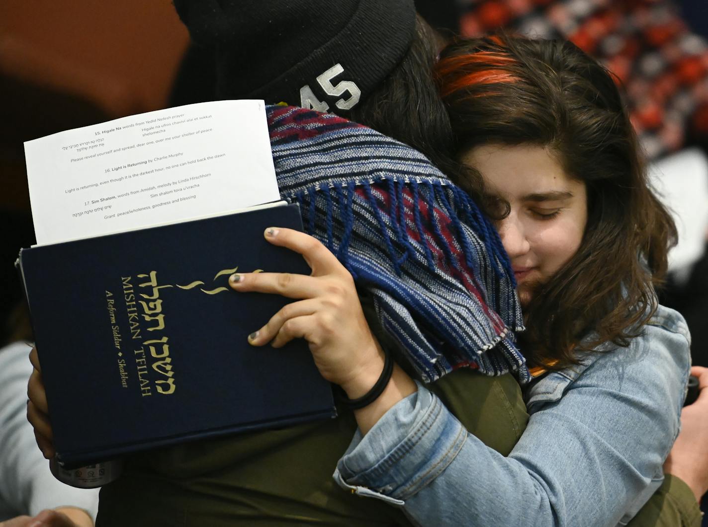 Templegoers embraced at Friday's Shabbat service at Shir Tikvah in Minneapolis.