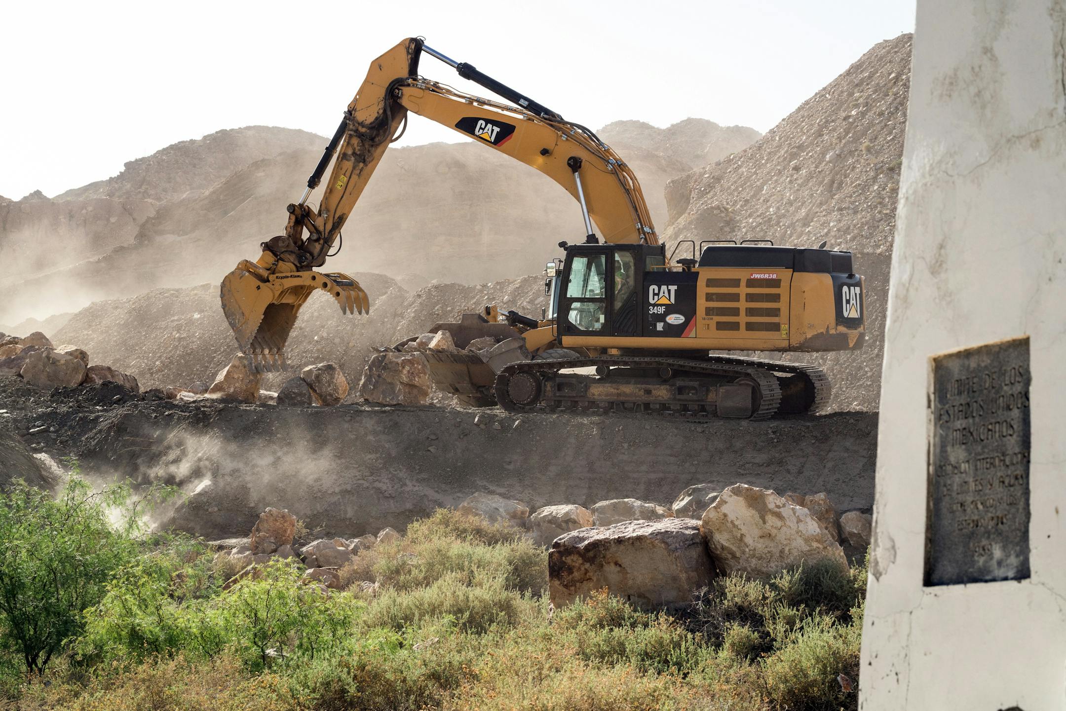 Machinery from Fisher Industries prepare the ground for a wall to be built on private property near El Paso, Texas.