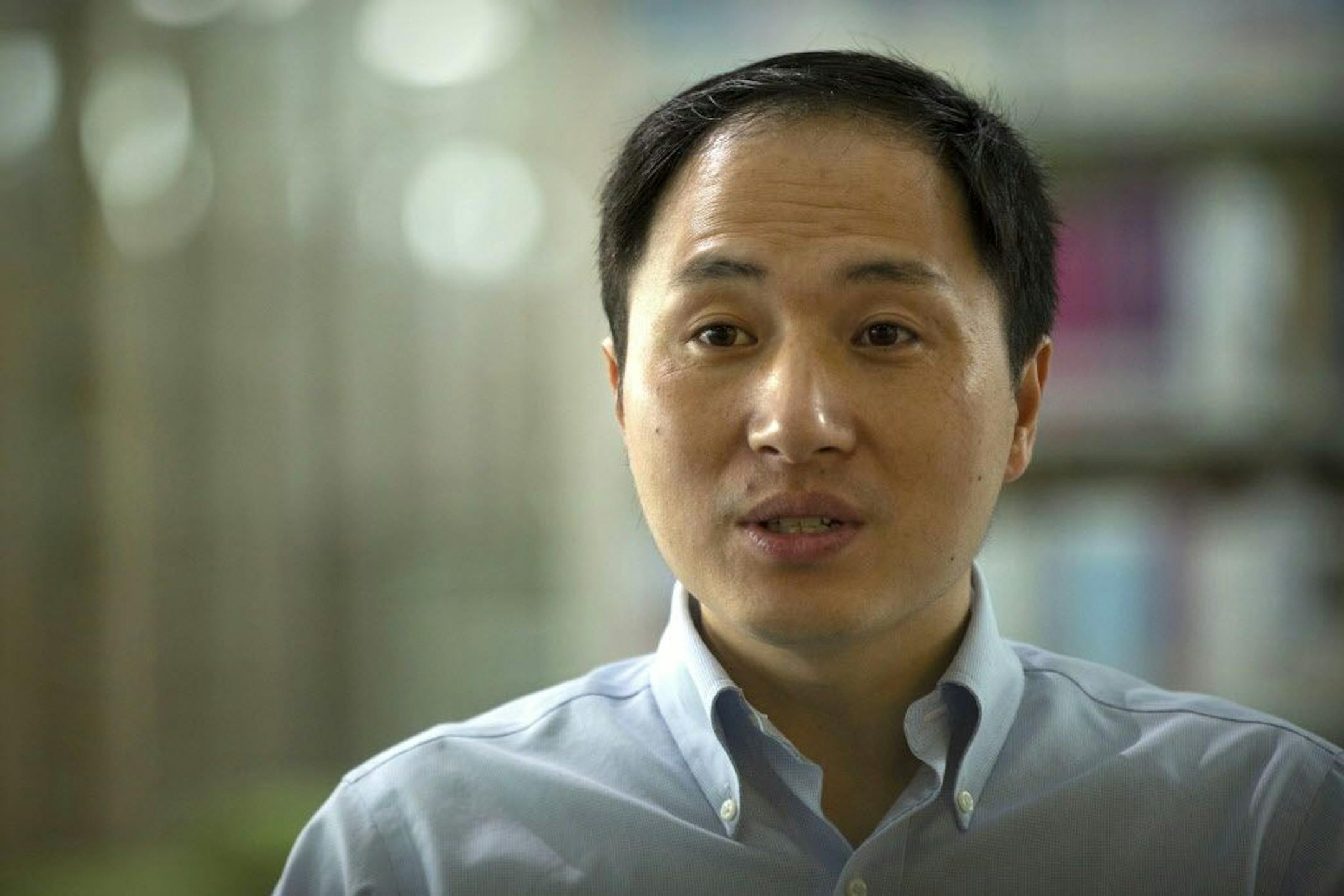 In this Oct. 10, 2018, photo, scientist He Jiankui speaks during an interview in Shenzhen in southern China's Guandong province. China's government on Thursday, Nov. 29, 2018, ordered a halt to work by a medical team that claimed to have helped make the world's first gene-edited babies.