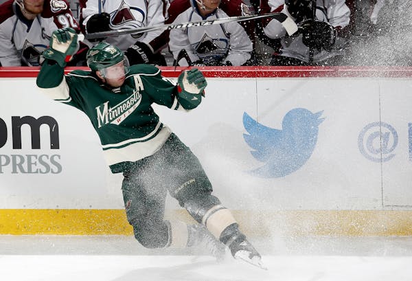 Ryan Suter (20) changed direction in front of the Colorado Bench in the second period.