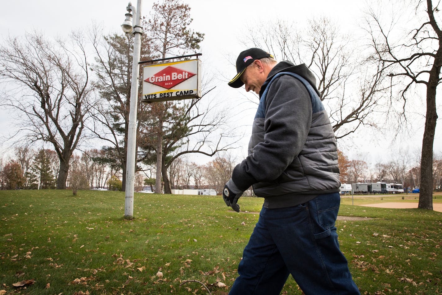 Camp manager Ken Larson walks past a sign that is part of the original Disabled Veterans Rest Camp. ] LEILA NAVIDI � leila.navidi@startribune.com BACKGROUND INFORMATION: Minnesota Veterans Campground on Big Marine Lake on Friday, November 3, 2017. Attendance at the Minnesota Veterans Campground on Big Marine Lake has grown nearly fivefold since 2010, driven by huge waves of returning veterans from Iraq and Afghanistan. The Washington County camp has undergone numerous major renovations, expansio