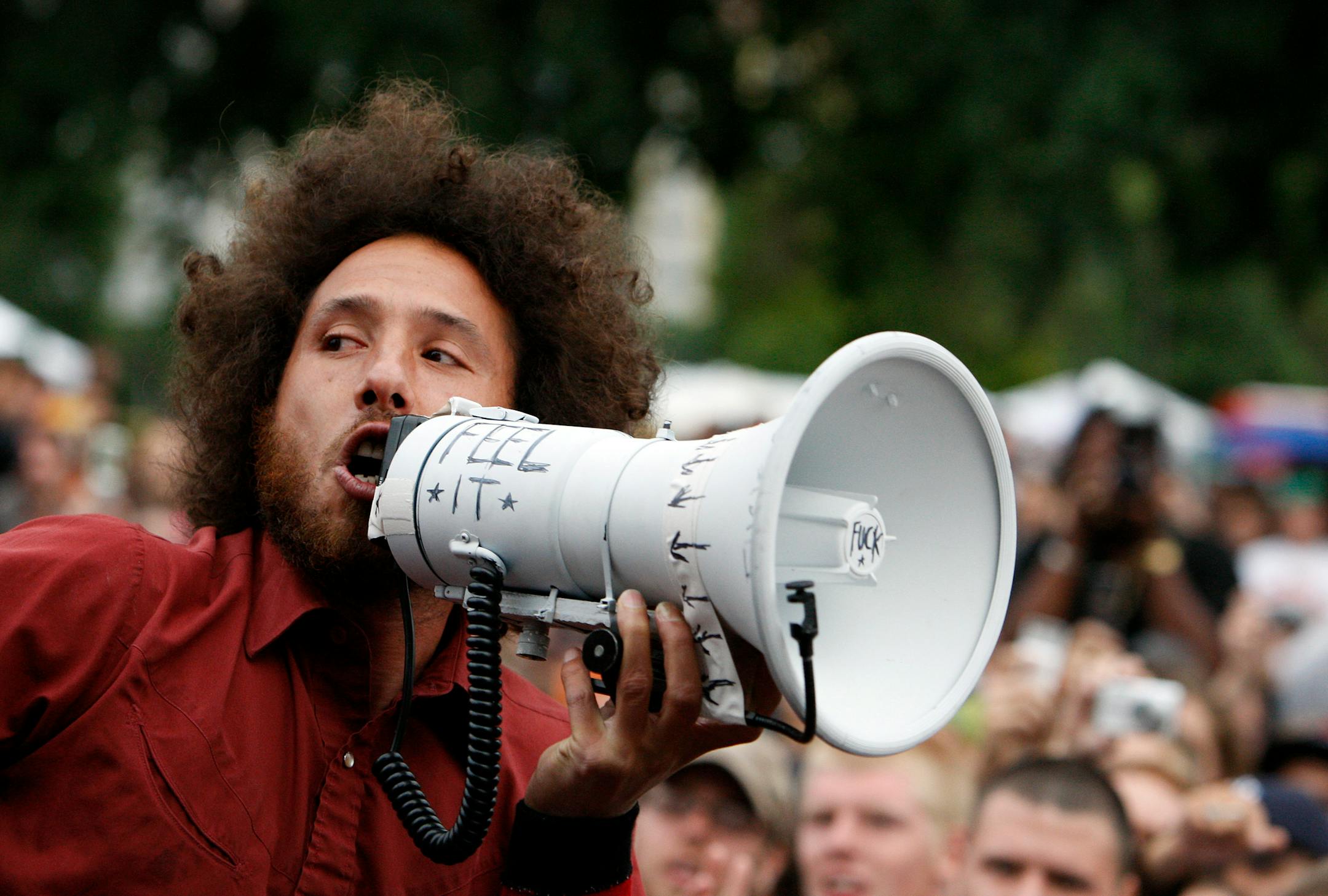 Zack De La Rocha, lead singer of Rage Against the Machine, sang to fans at the State Capitol in St. Paul on Tuesday. The band was not allowed to perform by police so they sang two songs over a bullhorn for fans.
