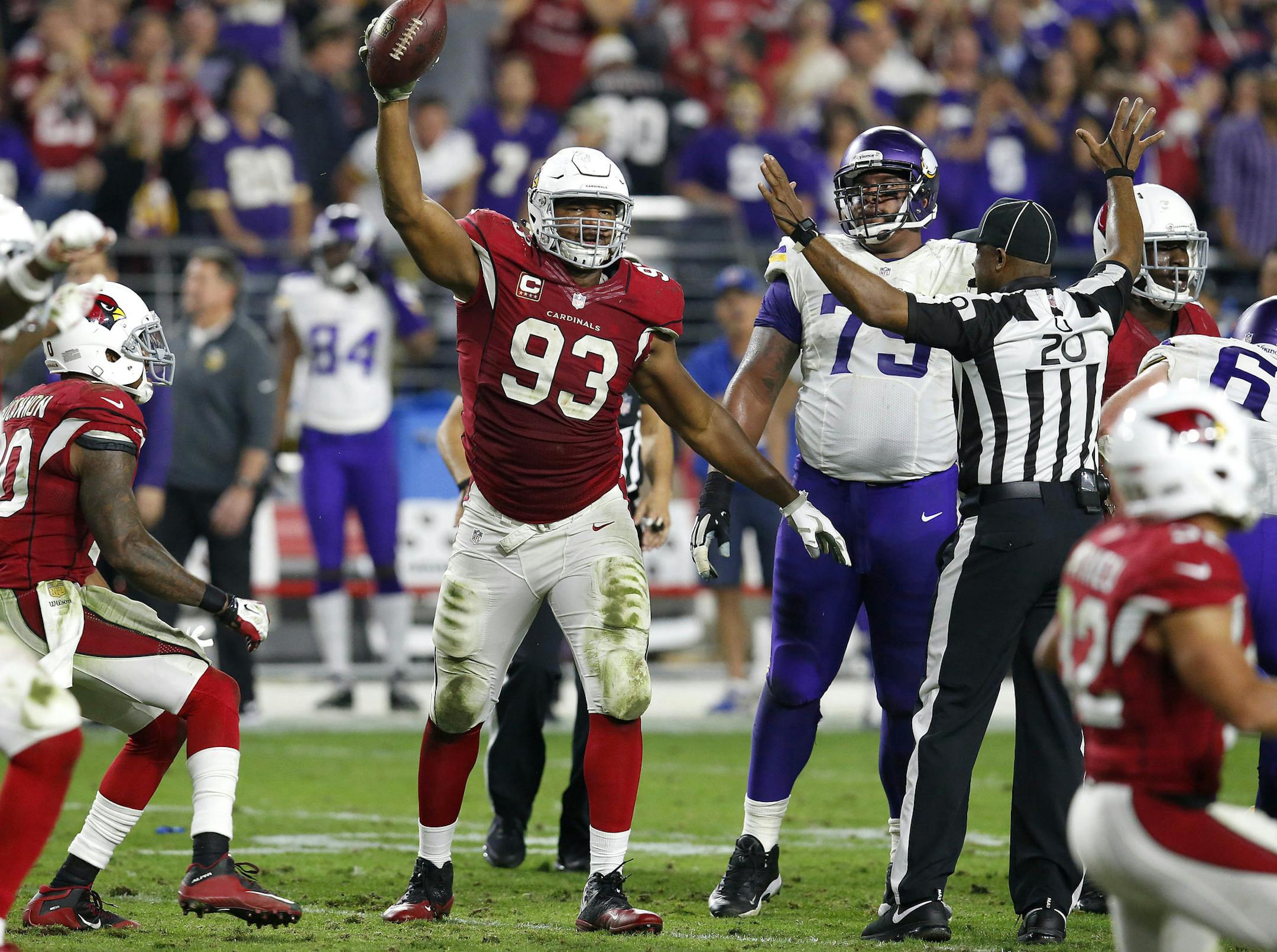 Arizona Cardinals defensive end Calais Campbell (93) holds up the football after a fumble recovery for the win against the Minnesota Vikings during the second half of an NFL football game, Thursday, Dec. 10, 2015, in Glendale, Ariz. The Cardinals won 23-20. (AP Photo/Rick Scuteri) ORG XMIT: AZMY147
