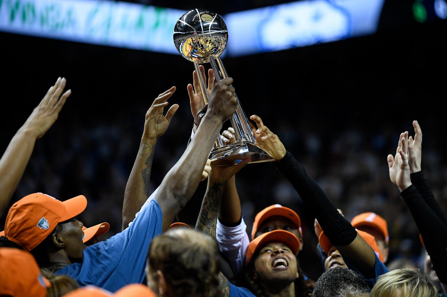 Lynx players hoisted the WNBA championship trophy above their heads Wednesday.