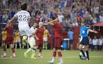 United States' Meghan Klingenberg (22) reacts after Germany's Celia Sasic, center, missed her penalty shot during the second half of a semifinal in th