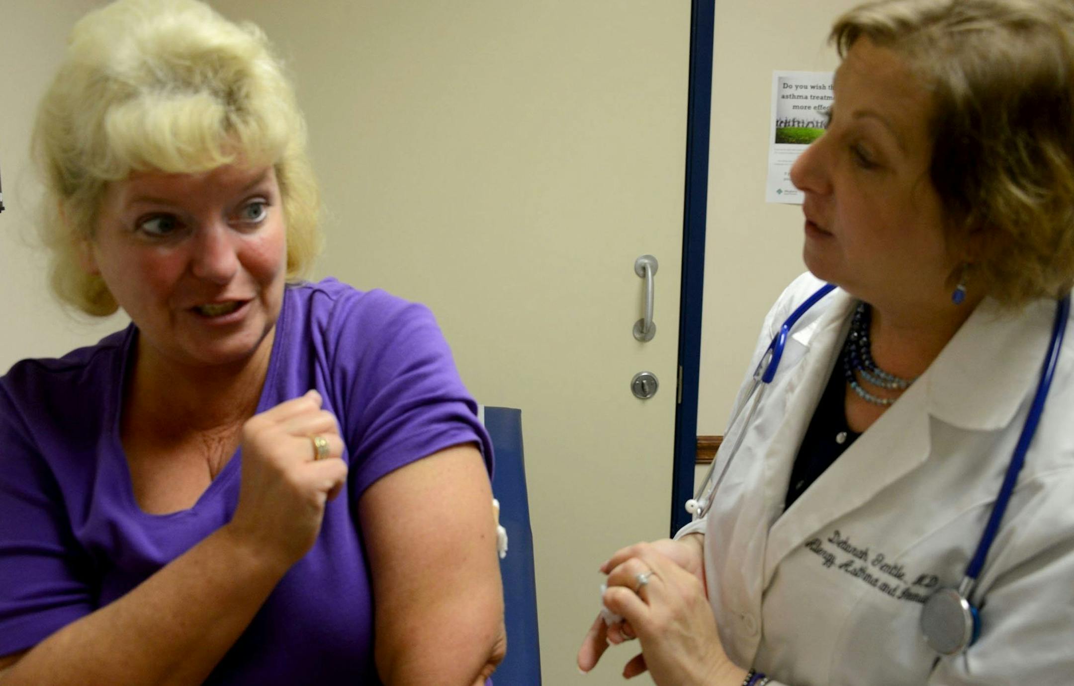 Elizabeth Sandhagen, of Whitehall Borough, Pa., talks after Dr. Deborah Gentile, who injected her with "Xolair" in Pittsburgh. (Darrell Sapp/Pittsburgh Post-Gazette/MCT) ORG XMIT: 1154168