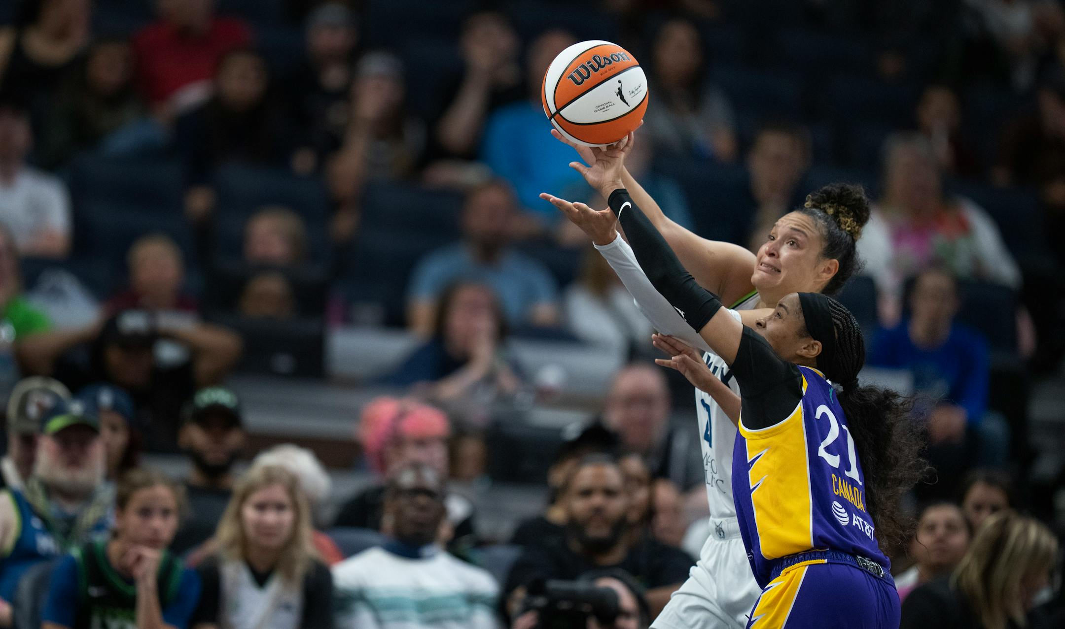 Los Angeles Sparks guard Jordin Canada (21) tipped the ball away from Minnesota Lynx guard Kayla McBride (21) in the second half .